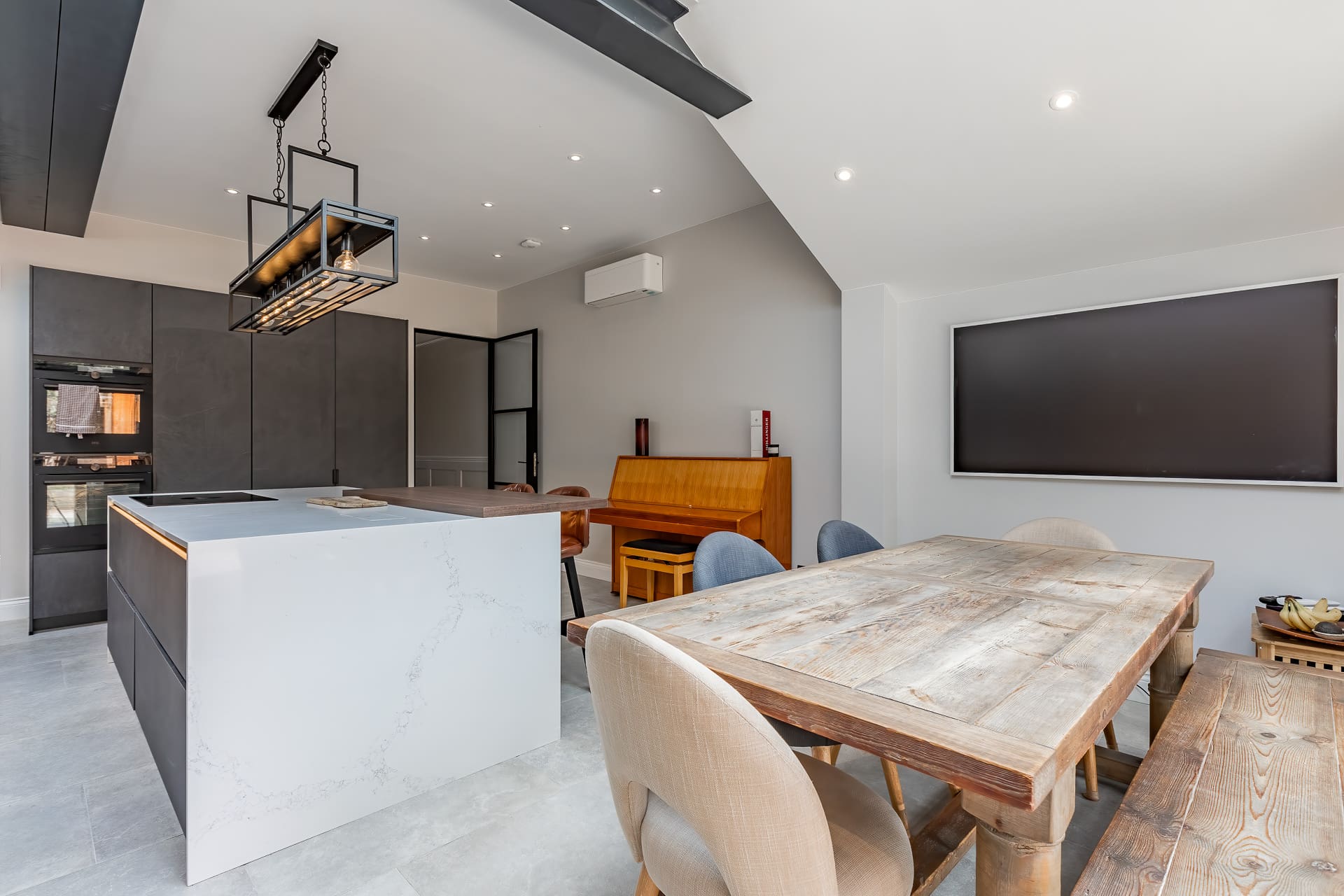 London & Kent Business & Brand Photography - white and grey kitchen with dining table and tv