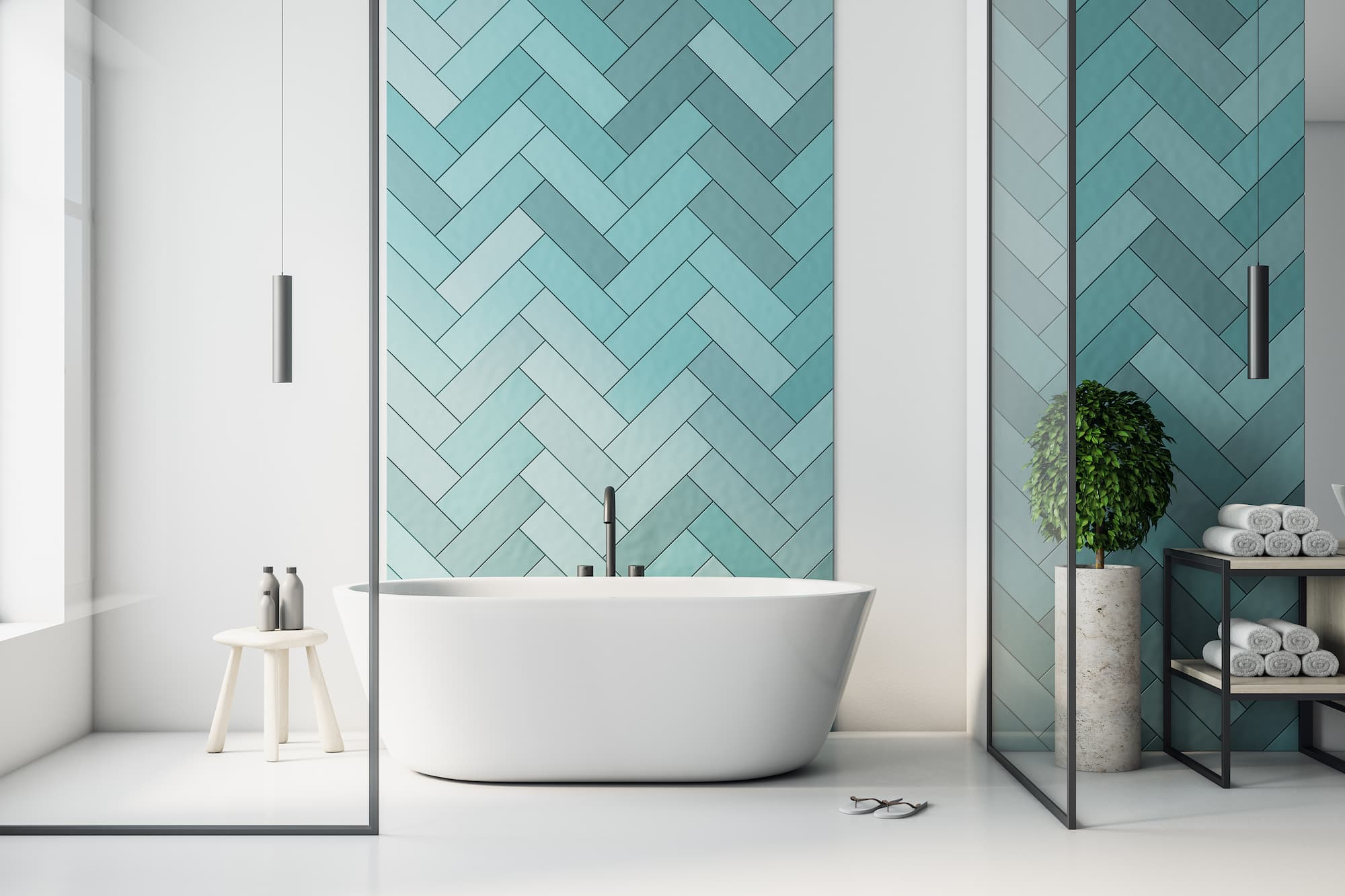 Contemporary bathroom renovation featuring a freestanding bath, herringbone wall tiles and glass shower enclosure completed by Sunny Build in South West London.