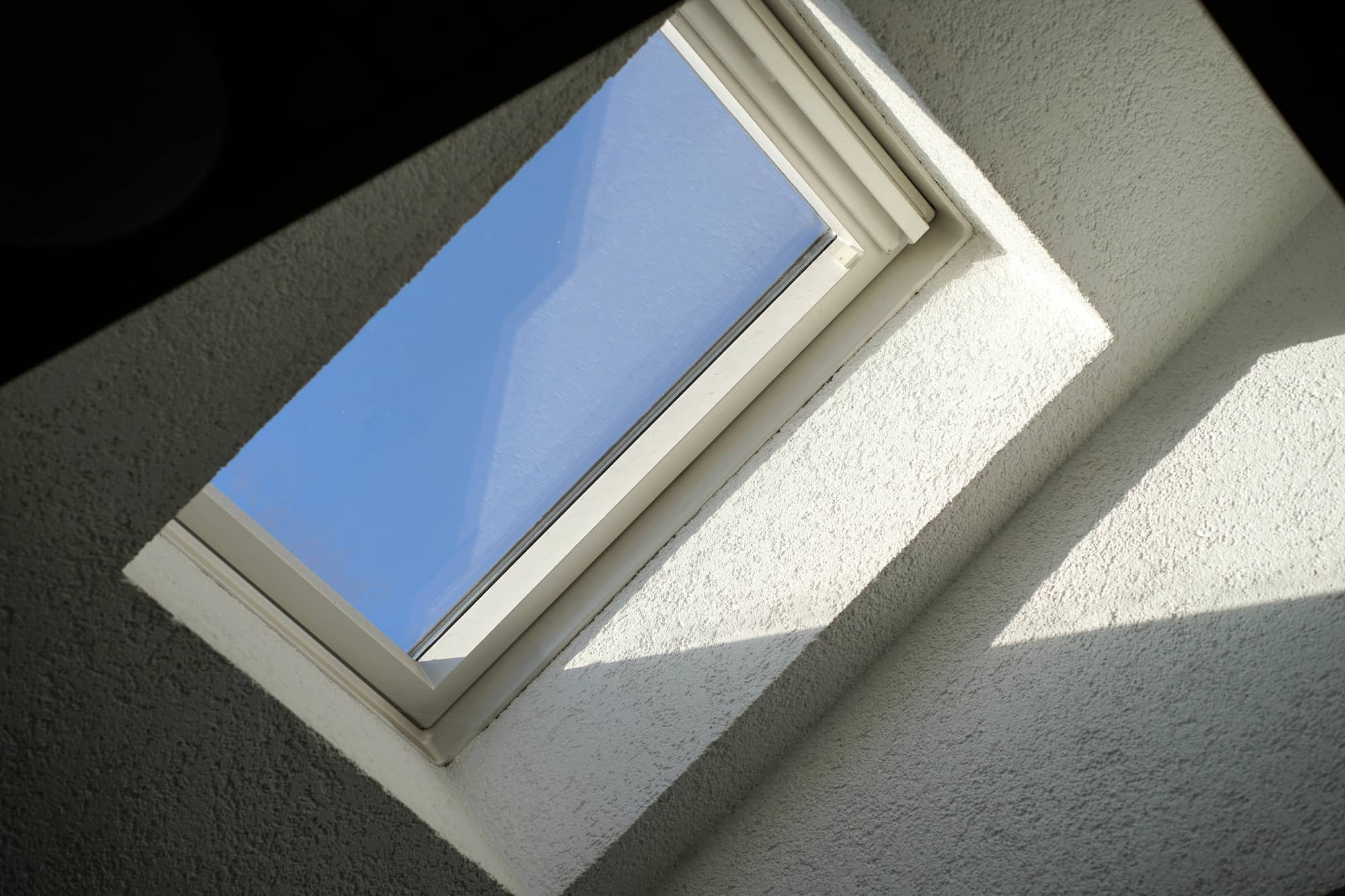 Natural daylight entering a converted loft through a modern rooflight skylight installed by Sunny Build in Kingston, South West London.